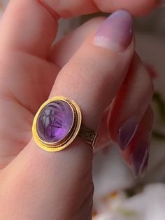 An extremely early Vintage scarab conversion ring with a sensual pink/orchid undertone to the sensual violet color of the stone. Once half of a pair of cufflinks, now a ring, this outstanding conversion has been fitted on a casting of a Victorian striped band. This particular ring is in excellent condition and is perfect for stacking or solo wear with a sizeable stone of 15mm. The ring is a delight to wear and would make a notable addition to any collection. Marks: 14k Age/Origin: Victorian scar Hourglass Pendant, Chevron Earrings, Chevron Bracelet, Chevron Necklace, Violet Color, Chevron Ring, Egyptian Revival, Pink Orchids, Cameo Pendant