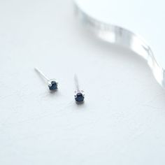 [DESCRIPTION] Tiny blue sapphire stud earrings set in silver. Simple stud earrings made of blue sapphires. This item is recommended for daily use. [Product information] Material: sterling silver Stone: Synthetic sapphire Length x Width: 3.5mm x 3.5mm (0.13in x 0.13in) Thickness: 3mm (0.11in) Post Diameter: 12mm (0.5in) ♥Sterling silver butterfly backs. ♥Listing is for a pair. #Free gift wrapping With wood box# -Comes with a dedicated wooden jewelry box. *The box design is subject to change without notice. Please note. Hypoallergenic Sapphire Earrings For Gift, Minimalist Blue Birthstone Earrings, Tiny Blue Minimalist Earrings, Dainty Blue Birthstone Earrings, Sterling Silver Sapphire Birthstone Earrings, Stacking Earrings, Sapphire Stud Earrings, Blue Sapphire Studs, Sapphire Earrings Studs