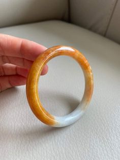 "🌈 Jade Bangle 53.4mm (2.10\"), Round Shape, Light Green & Yellow Brown 🌷 Untreated Natural Jadeite/ Grade A Jade 🌷 Certified : Yes 🌷 Jade from Myanmar/ Burma 🌷 Shape : Round 🌷 Inner diameter : 53.4mm / 2.10\" 🌷 Width & Thickness : 8.3 x 8.6mm 🌷 Color : Light Green & Yellow Brown 🌷 Free standard shipping from Hong Kong with tracking included 🌷 Take approximately 7-21 days to arrive worldwide" White Carved Bracelets, White Carved Round Bracelet, Yellow Jade Round Jewelry, Yellow Round Jade Jewelry, Round Yellow Jade Jewelry, Handmade Orange Round Bangle, Lavender Green, Light Lavender, Jade Bangle