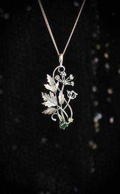 ITEM DESCRIPTION: The size H 5 cm x W 3 cm (2 x 1 1/3 inch). Weight - 5 g. You can buy it with a silver chain or without it. Even simple plants look very elegant. I made one of sterling silver, pretty green tourmaline, and peridot. This unique botanical jewelry looks like a real treasure of wild forest. It is really worthy of being in your precious collection. Expect many compliments on this! This handmade necklace will come to you in a gift box - ready for gifting. The parcel will be sent durin Silver Engraved Nature-inspired Necklace, Nature-inspired Engraved Sterling Silver Necklace, Nature-inspired Engraved Silver Jewelry, Green Sterling Silver Flower Pendant Jewelry, Silver Round Pendant Jewelry With Nature-inspired Style, Silver Nature-inspired Round Pendant Jewelry, Nature-inspired Engraved Flower Pendant Necklace, Nature-inspired Metal Pendant Necklace, Nature-inspired Sterling Silver Pendant Jewelry