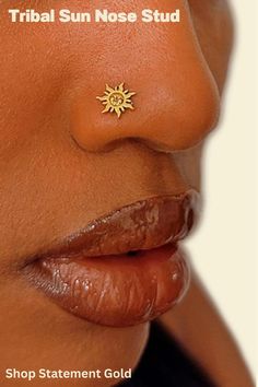 a woman's nose with sun nose stud in gold plated brass, on top of her lip