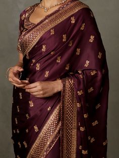 Editor's Note Elevate your style with our prune ari-hand embroidered girija sari, complete with an unstitched blouse. This ensemble is perfect for special occasions, exuding elegance and charm with its intricate embroidery and rich color. With the added convenience of an unstitched blouse, you can customize your look to your liking, making it a truly personalized attire. Make a lasting impression at any event with this classic and timeless outfit that effortlessly combines tradition and modernit Purple Saree, Ritu Kumar, Timeless Outfits, Embroidered Saree, Indian Designer Outfits, Intricate Embroidery, Sequin Fabric, Printed Sarees, Sarees Online