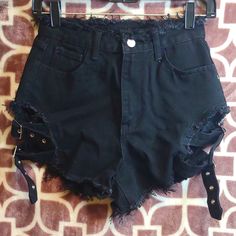 Nwot Women's Sexy/Punk Style High Waisted Black Jean Factory Distressed Cheeky Shorts. Frayed On Top And Frayed On Bottom Of Leg And Back Pockets 2 Adjustable Buckle Straps On Each Side Of Leg. Bought From (Shein) But Never Wore Them. Size: Xsmall Fits Like A Small Waist: 13" Flat Rise: 9" Flat Perfect Condition Comes From Smoking And Pet Free Home All Pre-Owned Items Are Dry-Cleaned Before Shipped Out Come Check Out My Other Listings In My Closet And Bundle And Save Black Grunge Shorts For Alternative Fashion, Black Grunge Shorts For Grunge Fashion, Edgy Festival Shorts, Fitted Punk Shorts For Night Out, Punk Style Fitted Shorts For Night Out, Alternative Style Bottoms For Summer Concerts, Alternative Style Summer Bottoms For Concerts, Edgy Black Shorts For Alternative Fashion, Black Gothic Shorts For Alternative Fashion