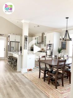 a dining room and kitchen area in a home with hardwood floors, white cabinets, and an open floor plan