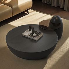 a coffee table with a magazine on it in a living room