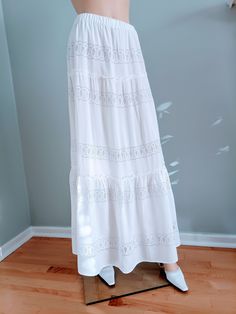 "Unique, bohemian style bridal skirt.    Boho style bridal skirt, made of white rayon with embroidered lace and 100% cotton lining. The skirt has 3 layers with an elastic waistband and cotton lining.  Material: Rayon, Cotton Available in sizes: S: 4-6, Waist:  25.5\"-26.5\", Hip: 36-37\" M: 8-10, Waist:  28\"-29\", Hip: 38-41\" Length: 38\"- 41\" The skirts are very versatile and comfortable and can be worn on the waist or low on the hips depending on personal taste." Bohemian Tiered Ruffled Maxi Skirt, Bohemian Dress With Ruffled Tiered Skirt, Spring Wedding Maxi Skirt With Ruffles, Bohemian Tiered Ruffled Skirt, Bohemian Tiered Flowy Skirt, Bohemian Long Dress With Ruffled Skirt, Feminine White Ruffled Maxi Skirt, Flowy Tiered Maxi Skirt For Brunch, Feminine White Maxi Skirt With Ruffles