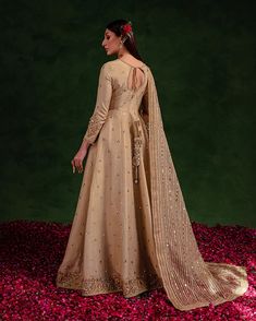 Brand: Maria Osama KhanCollection: MOK Salma Sitara Ready to Wear Collection '23 Description:Make your special day extraordinary with Rekhta, a golden pishwas made of Korean silk and embellished neckline sleeves. The Swarovski and dabka sitara work on the bottom give extra flare to this dress. Organza duppata with sequins and tilla adds the perfect finishing touch to this must-have luxury formal. NOTE: The color of the product may vary due to photography, extra lightening, and editing of the pic Luxury Embellished Sharara For Formal Occasions, Luxury Elegant Sharara With Embroidered Sleeves, Luxury Semi-stitched Tissue Silk Sharara, Saniya Maskatiya Formal Wear, Sitara Work, Suffuse By Sana Yasir Formal Wear, Silk Anarkali Suits, Dress Organza, Embellished Neckline