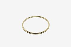 The perfect everyday gold bangle! -14k yellow gold -size small / inner diameter measures 2 1/4" Gold Hoop Bangle In Minimalist Style, Dainty 14k Gold Bangle For Formal Occasions, Simple 14k Yellow Gold Bracelets, Classic Gold Bangle For Everyday, Minimalist Gold Hoop Bangle, Minimalist Gold Hoop Bracelet, Classic 14k Yellow Gold Bangle, Stackable 14k Gold Bracelets With Round Band, Stackable 14k Gold Bracelet With Round Band