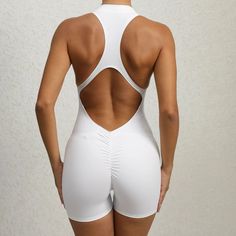 Get ready to romp and conquer your workout with the V-Scrunch Active Romper. Featuring removable bra padding and a 3/4 front zipper for customizable comfort. The halter racer-back design offers added support while the scrunch butt detail adds a playful touch (without revealing too much). You'll be the envy of the gym! Product Details: Nylon Removable bra padding 3/4 front zipper Halter Racer-back Design Scrunch butt detail Imported Fitted Nylon T-back Activewear, Sports Bra With Padded Back, Fitted Racerback Activewear With Built-in Padding, Sports Stretch Bra With Padded Back, Stretch Activewear With Padded Back For Sports, Sporty Activewear With Padded Back For Workout, Fitted Sports Bra With Padded Back, Sculpting Activewear With Built-in Padding For Workout, Stretch Sports Bra With Padded Back For Gym