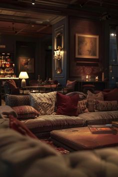 a living room filled with lots of furniture next to a fire place in a bar