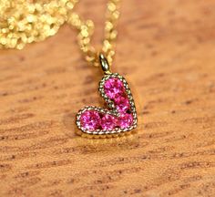 Tiny heart necklace - pink heart necklace - gold heart necklace - love necklace - bff necklace An itty bitty magenta pink heart having happily from a 14k gold vermeil chain at the length of your choice! This tiny, gold plated brass heart holds 5 sparkly crystals. Heart measurement: 8mm Looking for other charm necklaces? https://www.etsy.com/shop/BubuRuby?section_id=12318467 More from Bubu Ruby? https://www.etsy.com/shop/BubuRuby?ref=si_shop ♥ Handmade with love in sunny California ♥ These gems w Sparkly Crystals, Heart Necklace Gold, Pink Heart Necklace, Bff Necklace, Tiny Heart Necklace, Bff Necklaces, Necklace Love, Sunny California, Gold Heart Necklace