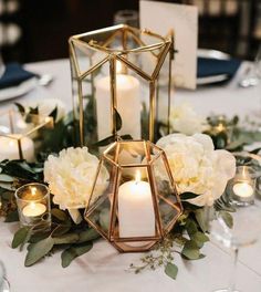 a table with candles and flowers on it