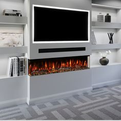 a television mounted on the wall above a fire place in a living room with bookshelves