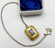 "Vintage gold filled chain and Victorian rectangle photo locket cameo pendant necklace, In good antique vintage condition. The chain 19\" long, Pendant 1\" x 5/8' and ½\" thick. Pendant dates 1890's. Weighs 6.9 gram. Marked 1/20 14k GF on the clasp. Thanks." Gold Rectangular Necklace For Keepsakes, Gold Rectangular Keepsake Necklace, Victorian Gold Rectangular Necklace, Victorian Rectangular Gold Necklace, Rectangular Vintage Charm Jewelry For Formal Occasions, Antique Square Locket Pendant Jewelry, Vintage Yellow Gold Necklace With Rectangular Pendant, Antique Square Pendant Locket Jewelry, Gold Rectangular Locket Necklace