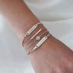 Dainty and masculine, this engravable id bracelet features a sleek bar on a Figaro chain. Perfect for layering with other bracelets or worn alone. Sterling Silver Plate measurement: Width 1in (2.7cm) x Height 0.2in (0.5cm) Italian Figaro chain, width 2mm Laser Engraving Handcrafted in NYC Hypoallergenic, lead and nickel free #B193 Engraving Bracelet, Sleek Bar, Disc Bracelet, Silver Bar, Figaro Chains, Figaro Chain, Id Bracelets, Engraved Bracelet, Initial Bracelet