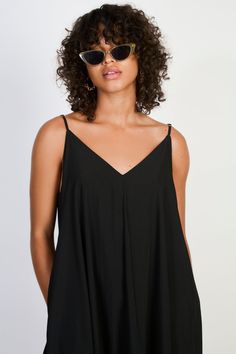 Black V neck floaty midi dress Chic Flowy V-neck Mini Dress, Chic V-neck Sundress For Vacation, Flowy V-neck Summer Dress, Chic Flowy Mini V-neck Dress, Trendy Black V-neck Maxi Dress, Chic V-neck Sundress For Spring, Chic Flowy Mini Length V-neck Dress, Chic V-neck Rayon Maxi Dress, V-neck Maxi Sundress For Day Out