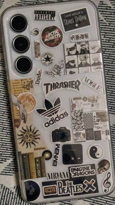 a cell phone covered in lots of stickers