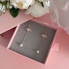 * DETAILS * - Natural Freshwater Baroque Pearls - Gold Plated CZ Paved Flower Charms 16*12mm ✨You may also like the matching necklace in the photos. Here is the link. https://www.etsy.com/JinnysJewelryBySeJin/listing/1258313379/14k-gold-filled-lariat-necklace-y-pearl?utm_source=Copy&utm_medium=ListingManager&utm_campaign=Share&utm_term=so.lmsm&share_time=1656464095232 ------------------------------------------ * CARE TIPS * ⭐️TO PREVENT TARNISH: Keep your jewellery in airtight plastic bags. It w Elegant Leaf Shaped Earrings As Gift, Elegant Leaf-shaped Earrings For Gift, Elegant Leaf-shaped Jewelry With Matching Earrings, Elegant Rose Gold Leaf Jewelry, Elegant Rose Gold Leaf-shaped Jewelry, Elegant Jewelry With Dangling Charms, Elegant Leaf-shaped Jewelry For Party, Elegant Leaf-shaped Party Jewelry, Teardrop Flower Charm Jewelry For Wedding