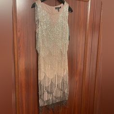 a dress hanging on a wooden door