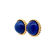 Add a touch of vintage elegance to your jewelry collection with these stunning Mid-Century Lapis Lazuli stud earrings. Crafted in 14k yellow gold, these earrings feature round cabochon cut Lapis Lazuli in a deep and rich blue hue. The stones have a total weight of 19.50 carats and are set in a twisted rope gold bezel, adding an intricate detail to these classic stud earrings. With their Mid-Century design, these earrings are a perfect addition to any vintage lover's wardrobe. Whether you're dressing up for a special occasion or adding a pop of color to your everyday look, these stud earrings are sure to make a statement. Vintage Lover, Blue Hues, Mid Century Design, Lapis Lazuli, Everyday Look, Color Pop, Jewelry Collection, Mid Century, Yellow Gold