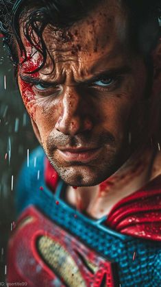 a close up of the face and chest of a man wearing a superman costume