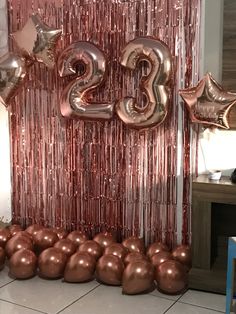 balloons and streamers are set up in front of the number twenty