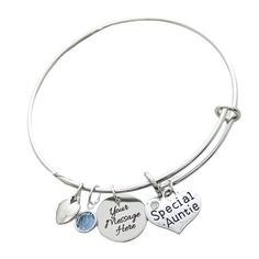 "A Kennebug Original DesignThis adorable gift starts with an adjustable wire bracelet that fits from 7\" to 8\" wrists.      The bracelet features a the charms shown. The small charm can be engraved around the edge with a name or small message. Includes birthstone as well.  All charms are soldered to the stainless steel bracelet in our Michigan studio to ensure they do not fall off during normal wear. Bracelet comes in adorable boutique package ready for gift giving. Enter the personalization in Personalized Adjustable Metal Name Bracelet, Adjustable Metal Friendship Charms, Adjustable Charm Bracelet With Lobster Clasp For Birthday, Adjustable Charm Bracelets For Birthday, Adjustable Dangle Charm Bracelet For Friendship, Nickel-free Adjustable Charms For Birthday, Nickel-free Adjustable Birthday Charms, Adjustable Name Bracelet With Charms For Birthday, Mother's Day Metal Charm Bangle Bracelet