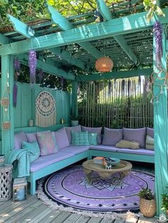 an outdoor living area with blue and purple furniture