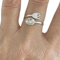 About item Item:- Fork and Spoon ring Material:- 925 sterling silver Title:- Vintage Sterling Silver Fork and Spoon Adjustable Ring, Fork Ring, Spoon ring, Gift For mom, Kitchen set ring, Gift For her, Women's ring Description:- We use 925 sterling silver to making jewelry. We accept all types of custom & personalized order. Please send us a message if you are interested in a custom creation. Shipping profile:- We ship all order within 3-5 days. But custom order takes time. Customer service :- If you have any question about our products & services, feel free to contact us. We do always best for our customers Other Specification:- Please Visit Our Shop home page to view our complete collection. If you need express shipping, please choose express shipping profile during checkout. Please make Silver Stackable Rings For Mother's Day Promise, Nickel-free Open Band Jewelry Gift, Nickel Free Open Band Jewelry Gift, Nickel Free Open Band Jewelry For Gifts, Sterling Silver Open Band Jewelry Gift, Personalized Sterling Silver Open Ring Jewelry, Sterling Silver Open Band Jewelry For Gifts, Sterling Silver Open Band Rings As Gifts, Nickel-free Rings For Anniversary And Mother's Day