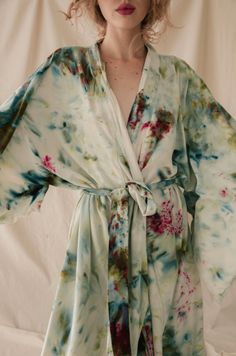 Rich auntie vibes activated. This lightweight and luxurious 100& raw silk kimono robe is fashioned in the spirit of a Japanese yukata or summer robe, perfect for lounging on a balcony or enjoying an evening in. Hand dyed in Upstate's studio, the robe is super soft thanks to its silk noil fabric, a material made from untreated silk reeled from the cocoon and covered with a protein called seracin that contains amino acids and collagen that absorb directly into the skin. Garden Party color way feat Festival Silk Kimono With Flowy Fit, Summer Silk Wrap Kimono, Summer Silk Kimono Flowy Fit, Flowy Silk Kimono For Summer, Flowy Silk Summer Kimono, Multicolor Silk Robe For Spring, Silk Summer Robe With Kimono Sleeves, Silk Robe With Kimono Sleeves For Summer, Bohemian Summer Kimono With Natural Dye