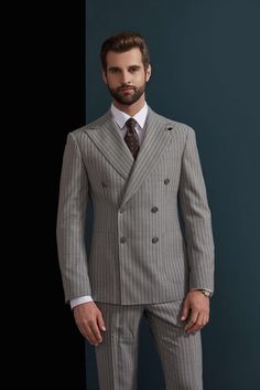 This ash and charcoal pinstripe suit for men or women is an nice addition to office wear or professional events. With the elegance of the grey stitching, this suit will pair well with many color varieties making it a suit that can be worn in any season and any setting. Like this look, but want to make some changes? Chat with a stylist or book an appointment. FREE SHIPPING ON ORDERS OVER $199 COLOR Grey COMPOSITION 100% Wool YARN COUNT Super 120s WEIGHT 290g FABRIC STYLE Pinstripe OCCASION Busine Elegant Gray Double Breasted Suit For Semi-formal Occasions, Elegant Striped Double-breasted Suit For Office, Striped Tuxedo Suit For Business, Pinstripe Double Breasted Business Casual Suit, Pinstripe Double Breasted Suit For Business Casual, Pinstripe Double Breasted Suit With Notch Lapel For Work, Elegant Pinstripe Double Breasted Suit For Work, Formal Pinstripe Double Breasted Suit With Notch Lapel, Pinstripe Double Breasted Suit With Suit Collar For Semi-formal