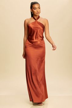 Indulge in effortless elegance with our Graceful Tie Halter Maxi Dress. Crafted from luxurious fabrics, this dress features a flattering tie halter neckline and a flowy maxi silhouette. Perfect for any special occasion, this dress will make you feel like a true fashion icon. Self: 98%Polyester 5%Spandex Lining: 100%Polyester Silk Halter Neck Evening Dress, Elegant Flowy Long Backless Dress, Fitted Maxi-length Halter Bridesmaid Dress, Fitted Maxi Length Halter Bridesmaid Dress, Formal Halter Neck Midi Dress With Tie Back, Fitted Maxi Length Halter Dress For Bridesmaids, Flowy Tie Back Maxi Dress For Evening, Flowy Halter Dress With Tie Back For Party, Silk Halter Neck Dress For Gala