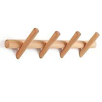 three wooden pegs are hanging on the wall