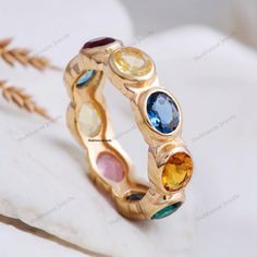 18K Yellow Gold Multi Sapphire Ring Colorful Gemstone Wedding Band Full Eternity Band Minimalist Band Unique Rainbow Band Anniversary Gift Description: Stone: Multi Gemstones (Lab Created) Stone Size: 5 x 2.5 MM Stone Shape: Oval Stone Color - Multi Color Stone cut - Brilliant Cut Finishing- Excellent feel free to contact me if you have any questions  Gemstone color may slightly vary from listed image due to the nature of all natural gemstone or different monitor settings TURNAROUND TIME Your order will be ready for shipment in 4-8 business days. Free economy shipping for US, UK, Germany- 10-15 business days delivery time. shipping upgrade available for US, UK, Germany- 5-7 business days delivery time. Please check shipping times for other countries by entering your country at shipping par Gemstone Wedding Band, Rainbow Band, Gemstone Wedding, Saphir Ring, Multi Sapphire, Color Stone, Oval Stone, Eternity Band, Eternity Bands