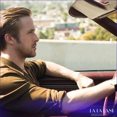 a man sitting in the driver's seat of a car