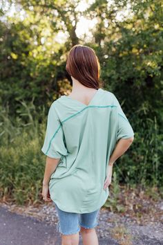 *ALL SALES FINAL* *NOT ELIGIBLE FOR RETURN* Introducing the Catherine Top! With a fresh mint green color and ribbed texture, this top is both oversized stylish and comfortable. The wide v-neck front and back add a touch of elegance, while the drop shoulder short sleeves keep it relaxed. Perfect for any occasion. Fits true to size. Model is wearing a small and is 5'6". Plus model is wearing a 1X and is 5'7". Size Chart Length Bust S 27" 58" M 28" 60" L 29.5" 62" XL 31.5" 64" 2x 31.5" 67" 3x 31.5" Casual Green V-neck Short Sleeve Top, Oversized Green V-neck Top, Casual Solid Color V-neck Top For Spring, Casual V-neck Top For Spring, Green Relaxed Fit V-neck Top, Oversized V-neck Top With Ribbed Neckline, Green V-neck Top For Day Out, Green Top With Ribbed Neckline And Relaxed Fit, Green Relaxed Fit Top With Ribbed Neckline