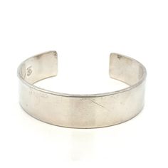 "Designer Richard Kalbe Sterling Silver Wide Cuff Bangle Bracelet  - Modern Silver Bracelet~ ET1417 Metal Content: 925 Sterling Silver Measurements Width:  5/8\" (16mm) Opening: 2.5\"- fits an average wrist Weight: 48.24 Grams Stamped: Richard Kalbe Sterling Condition: Good Pre-Owned- scratches noted to outside surface of cuff.  Please see listing photos Each piece is thoroughly examined and refinished as needed by our professional jewelers, tested to guarantee metal content,  graded by our in-house GIA (Gemological Institute of America) Graduate Gemologist, and inspected for quality before being carefully packaged and promptly shipped. Thank you for taking the time to shop with us! We have hundreds of more listings, with more being added every week! From necklaces to bracelets, the classi Elegant Stamped Cuff Bracelet, Classic Hallmarked Cuff Bracelet For Wedding, Classic Adjustable Hallmarked Bangle, Classic Adjustable Open Cuff Bracelet, Elegant Stamped Bangle For Formal Occasions, Elegant Round Stamped Bracelets, Elegant Stamped Bracelet, Elegant Stamped Bracelet For Formal Occasions, Elegant Stamped Bangle Bracelet