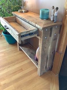 an old wooden desk with drawers on the bottom and one drawer open to reveal something