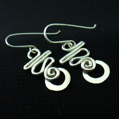 These earrings are hand crafted in solid sterling silver.I use 16 gauge wire for these so they're nice and light but not flimsy.For a unique,long lasting and clearly handmade pair of everyday dangles that won't break the bank.These will do the trick. Handmade Silver Drop Wrap Earrings, Unique Silver Plated Wire Earrings With Ear Wire, Unique Silver Plated Wire Earrings, Hypoallergenic Silver Wrap Earrings In Sterling Silver, Hypoallergenic Silver Sterling Silver Wrap Earrings, Hypoallergenic Sterling Silver Wrap Earrings, Unique Sterling Silver Pierced Wrap Earrings, Unique Sterling Silver Wrap Earrings, Silver Hypoallergenic Dangle Wrap Earrings