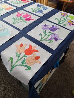 a quilted table cloth with flowers on it