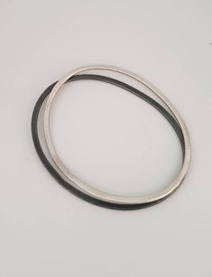 This is a beautiful delicate sterling silver bracelet . A minimalist oval bracelet in a matt finish. It is great to wear alone or stack it up. Each bangle is hand-crafted in my studio. This bangle was made with alot of love. This bracelet is a great gift for women and could be a great delicate bracelet or brides and bridesmaids. This listing is for a single dimensions: small: 7/5.5 cm medium:7.7/6 cm large: 8.2/6.5 cm -Sterling silver -Free shipping worldwide -Gift box If you wold like to see ot Minimalist Sterling Silver Oval Bracelets, Minimalist Oval Sterling Silver Bracelets, Minimalist Sterling Silver Oval Bracelet, Minimalist Oval Bracelets For Everyday Wear, Minimalist Oval Sterling Silver Bracelet, Minimalist Silver Oval Bracelets, Minimalist Oval Bangle As A Gift, Minimalist Oval Bangle As Gift, Minimalist Oval Bangle Gift