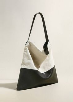 Indulge in luxury with our Patchwork Canvas Leather Colorblock Tote Bag. Handcrafted with a unique patchwork design of durable canvas and genuine cowhide leather, this two-tone bag exudes sophistication and style. Its spacious interior and tote style make it perfect for women on the go. Elevate your wardrobe with this exclusive piece. Size info 15 3/8" (39cm) width 15 3/8"(39cm) height 1 3/4"(4.5cm) depth Details Open top Top carry handle Interior slip pocket and zip pocket Canvas, genuine cowhi Modern Rectangular Hobo Bag With Leather Trim, Modern Hobo Bag With Leather Trim Tote, Modern Leather Trim Hobo Tote Bag, Everyday Beige Patchwork Shoulder Bag, Canvas Patchwork Shoulder Bag For Everyday, Black Square Canvas Shoulder Bag, Everyday Canvas Patchwork Shoulder Bag, Patchwork Satchel Hobo Bag For Daily Use, Patchwork Satchel Hobo Bag For Everyday Use