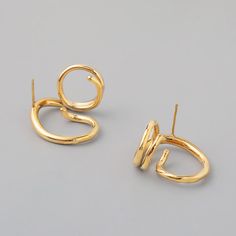 Our coating and high polish add secret ingredient to the rings for your contemporary & chic outfit. Abstract geometric earrings that will never go out of style, this jewelry piece is simple enough to accessorize easily but creative enough to make your look stand out. This pair of 18K gold statement earrings that compliments any outfit, easily create stylish look in Parisian, Minimalist, Bohemian, or even Punk. • S P E C I F I C A T I O N • Finish: 18K multi-layered gold plating on titanium steel Dimension: approx. 22 cm x 24mm For ring of this style please visit here. Modern Metal Pierced Ear Cuff, Modern Metal Ear Cuff For Gifts, Modern Metal Ear Cuff For Gift, Modern Metal Ear Cuff As Gift, Modern Plated Hoop Earrings, Gold Minimalist Metal Ear Cuff, Modern Gold Ear Cuff For Party, Modern Single Earring With Open Ring Shape, Modern Metal Jewelry With Simple Design