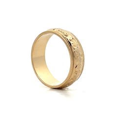 Enjoy the elegance of the past with this vintage Mid-Century unisex wedding band. Crafted in 14 karat yellow gold, this ring showcases a beautiful orange blossom engraving that adds a unique, artistic flair. At 6.5 mm wide, the band provides a comfortable fit while texture is enhanced by a high polish finish. The ridged edge detailing enhances its visual appeal with intricate texture. Whether paired with an engagement ring or worn alone, this beautiful ring is versatile and unique. Heirloom Ring With Thick Decorative Band, Heirloom Engraved Ring With Decorative Wide Band, Vintage Thick Band Wedding Jewelry, Ceremonial Yellow Gold Engraved Ring With Decorative Band, Heirloom Rings With Decorative Round Band, Timeless Gold Engraved Ring With Decorative Band, Yellow Gold Etched Bands For Anniversary, Etched Yellow Gold Bands For Anniversary, Heirloom Yellow Gold Wedding Ring With Thick Band