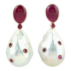 These pearl earrings are thoughtfully and meticulously crafted with 18 Karat yellow gold. It is set with 58.65 carats pearl and 6.51 carats ruby. FOLLOW MEGHNA JEWELS storefront to view the latest collection & exclusive pieces. Meghna Jewels is proudly rated as a Top Seller on 1stDibs with 5 star customer reviews. All items manufactured by us are handmade and can be customized or redesigned. Composition Size-37X15 MM Total Weight-17.63 Gold Weight(Gms)-4.598 Pearl Wt(Cts)-58.65 Ruby Wt(Cts)-6.51 Pearl Earrings Designs, Kawaii Shoes, Jewelry Words, Nice Outfits, Pearl Design, Custom Earrings, Jewelry Inspo, Top Seller, Ear Jewelry