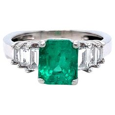 LOVE this Classic Vintage Natural Emerald Engagement Ring! Crafted in Platinum, the engagement ring features an Emerald Cut Natural Emerald, approximately 1.50ct in weight, of excellent quality. The deep, rich green color of this Emerald is just perfect! It's flanked a total of Six Baguette Cut Diamonds, totaling 0.72ct, of G/VS2 quality! Other Important Details: The ring is a Size 5.5. The ring is not stamped, but has been tested to be Platinum. The rings weigh 6.8 grams. The total carat weight White Gold Emerald Ring, Green Diamond Rings, Gold Emerald Ring, Rings Green, Sapphire Cocktail Ring, Diamond Gold Ring, Green Emerald Ring, Emerald Blue, Emerald Ring Gold