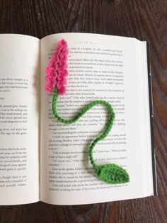 Pink crochet snapdragon with green leaf bookmark sitting on top of a book page Marque-pages Au Crochet, Snapdragon Flowers, Bookmark Crochet, Crochet Bookmark Pattern, Crochet Bookmark, Beginner Crochet Tutorial, Bookmark Ideas, Flower Bookmark, Crochet Bookmarks