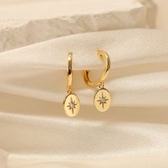 GOLD STARBURST HUGGIE HOOPS  These stunning handcrafted half-moon earrings feature a minimalist concept that is perfect for you or as a gift for her on any occasion. The timeless and elegant design is a beautiful accent to any outfit. Our best-selling gold earrings stack is designed with a focus on minimalist aesthetics and timeless charm. This everyday silver earring set combines the elegance of a solid silver material with the brilliance of a crescent moon charm, making it a must-have in your Celestial Gold Dangle Hoop Earrings, Gold Star-shaped Hoop Earrings With Ear Wire, Gold Celestial Small Hoop Earrings, Elegant Gold Hoop Earrings With Star Charm, Gold Star Charm Hoop Earrings, Gold Hoop Earrings With Star Charm For Gift, Gold Hoop Earrings With Star Charm As A Gift, Gold Star-shaped Single Hoop Earring, Gold Star-shaped Jewelry With Dangling Charms