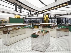 the interior of a restaurant with green and white decor