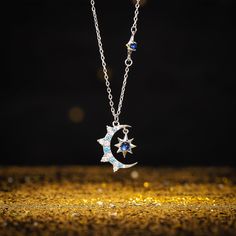 Illuminate your style with our Moon & Eight-pointed Star Necklace featuring a captivating blue diamond. This celestial-inspired piece captures the magic of the night sky, with the moon and star symbolizing dreams and guidance. The addition of the radiant blue diamond infuses a sense of allure, making it a distinct and captivating accessory. Embrace the celestial magic with the Moon & Eight-pointed Star Necklace - a luminous reflection of the cosmos. DETAILS Materials:   925 Sterling Silver, Spin Moon Phase Star Shaped Jewelry Gift, Celestial Star-shaped Silver Jewelry, Mystical Silver Star-shaped Jewelry, Celestial Star Jewelry For Jewelry Making, Mystical Silver Star Jewelry, Magical Silver Jewelry With Sun And Moon Design, Celestial Crescent Jewelry With Star Charm, Mystical Blue Pendant Necklace, Magical Moon Shaped Sterling Silver Necklace